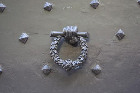 Doorknocker on the front door of the Italian buildingのeditorial素材