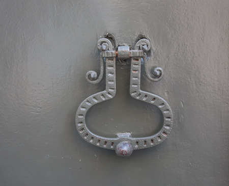 Doorknocker on the front door of the Italian buildingのeditorial素材