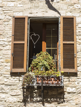 Wooden shutter on a historic house in an Italian cityの写真素材