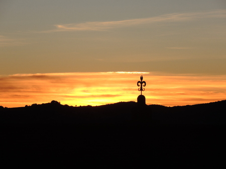 The wrought iron lily of Gubbio at sunsetの写真素材