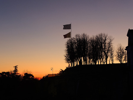 Bergamo, old city. Italy, November 17, 2017. Fiery sunset during the fall season at Saint Giacomo ancient doorのeditorial素材