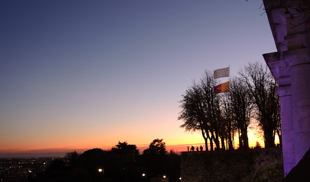 Bergamo, old city. Italy, November 17, 2017. Fiery sunset during the fall season at Saint Giacomo ancient doorのeditorial素材