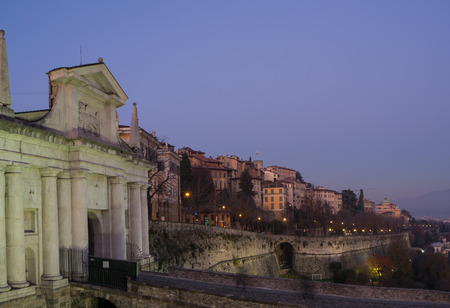 Bergamo, old city. Italy. Sunset on the Saint James ancient door and the Venetian wallの写真素材