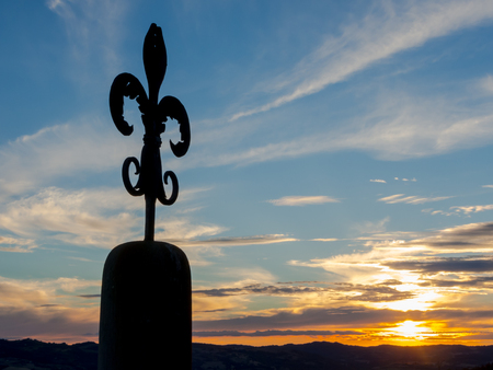 The wrought iron lily of Gubbio at sunsetの写真素材