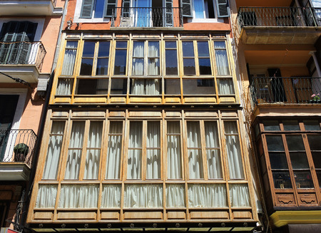 Palma de Mallorca, Spain. The typical balconies on the facades of the buildings and houses in the old city centerのeditorial素材