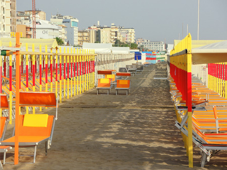 Beach umbrellas, gazebos and sun beds at Italian sandy beaches. Adriatic coast. Emilia Romagna regionのeditorial素材