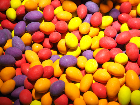 Close up of a bowls filled with a large selection of different colored soft candiesの写真素材