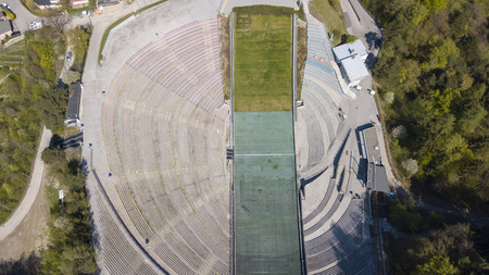 Innsbruck, Austria, April 21, 2018. The stadium of the ski jumping on the hill tower and the track. It can hold 28,000 spectatorsのeditorial素材