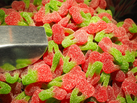Close up of a bowls filled with a large selection of different colored soft candiesの写真素材