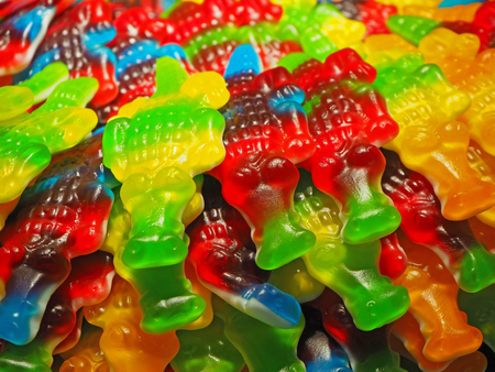 Close up of a bowls filled with a large selection of crocodiles and soft candiesの写真素材