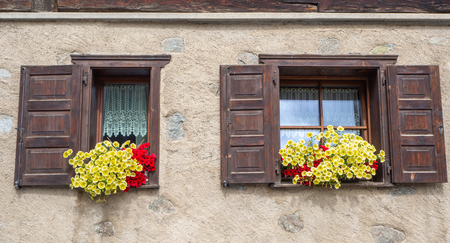 Traditional flowered windows at the Italian Alps and dolomitesの写真素材