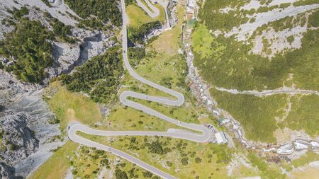 Road to the Stelvio mountain pass in Italy. Up and down amazing aerial viewの写真素材