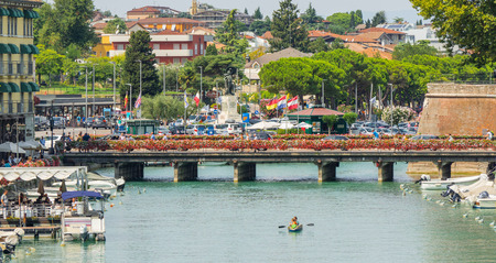 Peschiera del Garda, Italy. The beautiful historical city center. Promenade and entertainment along the water canal. Garda Lakeのeditorial素材