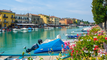 Peschiera del Garda, Italy. The beautiful historical city center. Promenade and entertainment along the water canal. Garda Lakeのeditorial素材