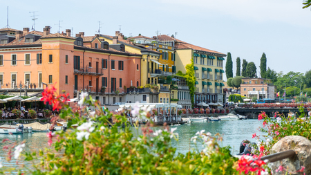 Peschiera del Garda, Italy. The beautiful historical city center. Promenade and entertainment along the water canal. Garda Lakeのeditorial素材