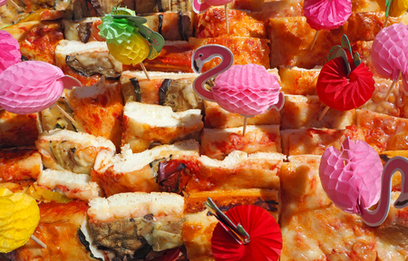 Mix of delicious appetizers and small pizzas made of puff pastryの写真素材