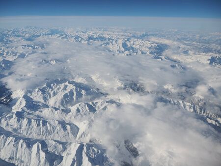 Landscape of the Alps during winter with fresh snow. View from airplane