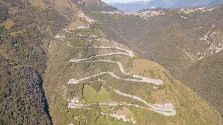 Drone aerial view of the mountain road in Italy. Bends creating beautiful shapesの写真素材