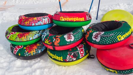 Monte Pora, Italy. Colorful rubber or plastic ski ring to slide on the snow. Fun in the winter seasonのeditorial素材
