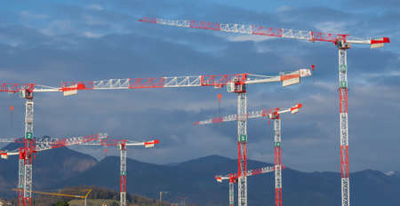 Bergamo, Italy. New district Chorus Life under construction. Construction site with huge number of cranes. Red and white cranesのeditorial素材