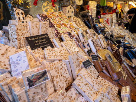 Bergamo, Italy. View of the Christmas market in the city center. Stalls selling different types of nougat and sweetsのeditorial素材