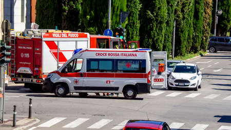 Accident between cars in an Italian city with the rescue of the firefighters and the Red Crossのeditorial素材