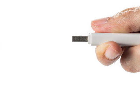 Flash drive in hand isolated on white backgroundの写真素材