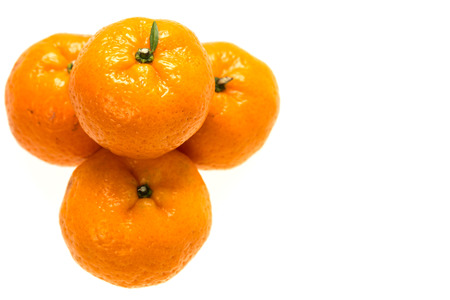 four oranges isolated on white backgroundの写真素材