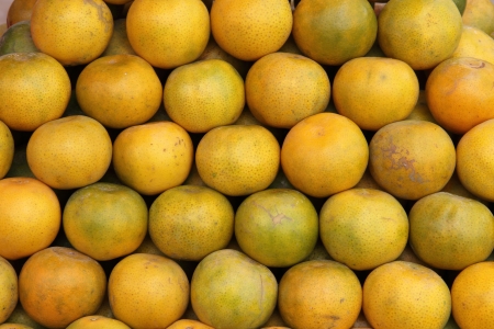 Plenty of tangerines, for sale on a market stall in Thailand の写真素材