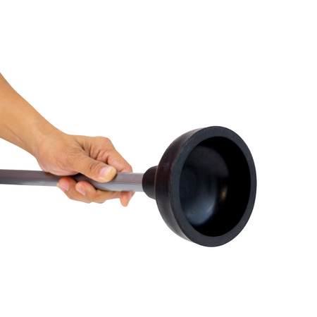 Holding black rubber plunger for toilet pump isolated over white backgroundの写真素材