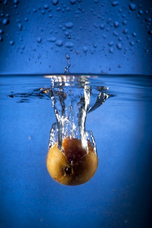 Loquat Splashing in Waterの写真素材
