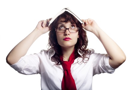 Woman with a Book on Her Headの写真素材