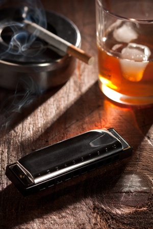 Harmonica with Whiskey and Cigarette の写真素材
