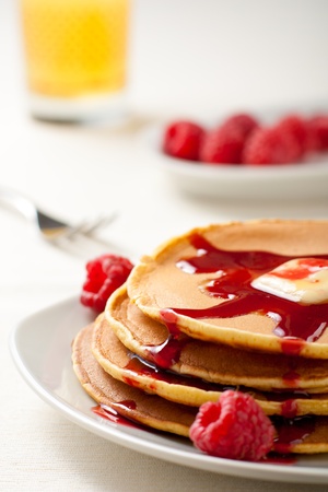 Pancakes with Raspberries, Syrup and Orange Juiceの写真素材