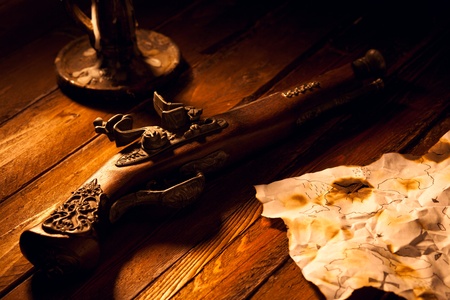 Antique Flintlock Pistol with Map and Candleの写真素材