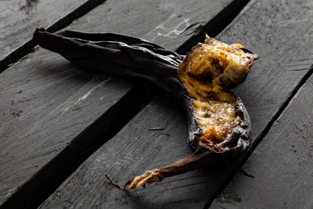 Black Rotten Banana on Woodの写真素材