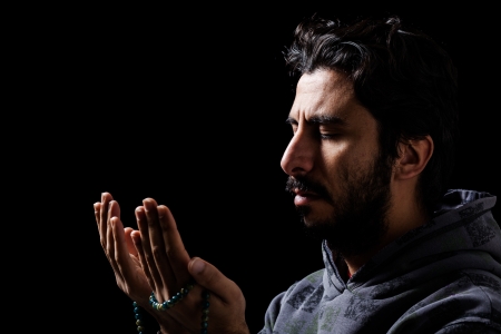 Western Muslim Praying with Tasbihの写真素材