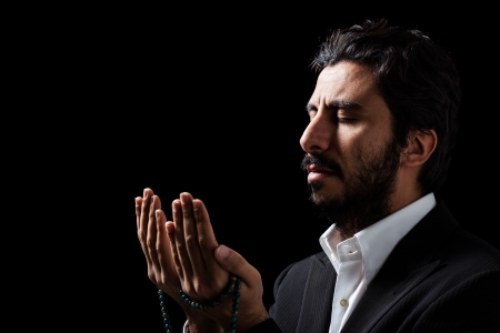 Western Muslim Praying with Tasbihの写真素材