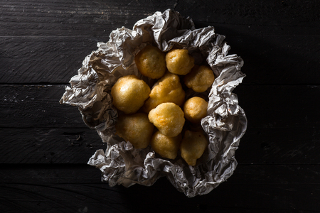 Pettole, Traditional Italian Doughnuts from Apulia, on Crumbled Paper