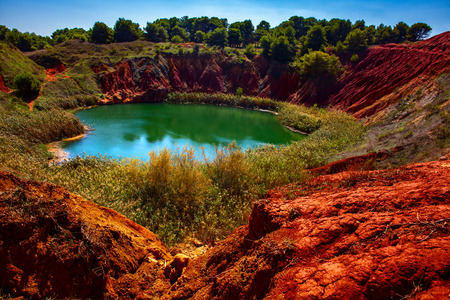Bauxite Quarry with Lake at Otranto, Apuliaの写真素材