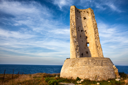 Torre del Serpe (or Torre dell'Idro) at Sunset. An Ancient Roman Lighthouse at Otranto, Apulia.の写真素材