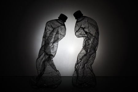 Two Crumpled Plastic Bottles Silhouette