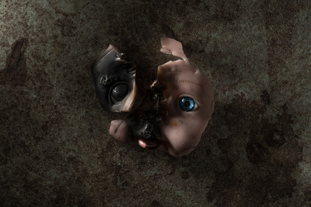 Burned Doll Face Ripped Off from Its Bodyの写真素材