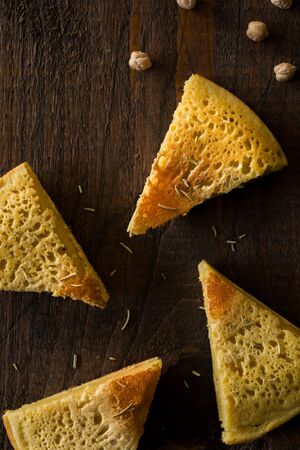 Sliced Chickpea Omelet on Wooden Surface