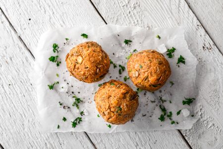Vegan Lentil Meatballs on Baking Paper on White Wooden Surfaceの写真素材