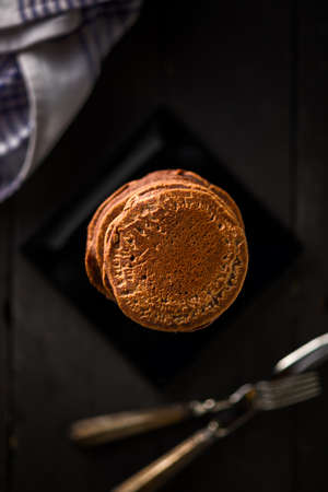 Vegan Chocolate Pancakes on Black Woodの写真素材