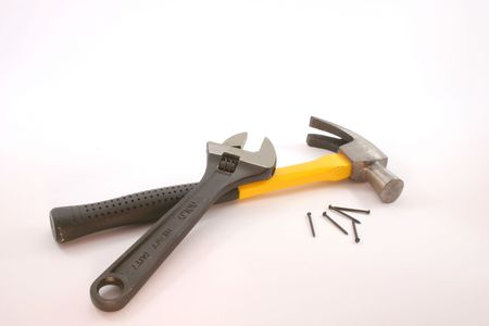 A wrench, hammer and some nails