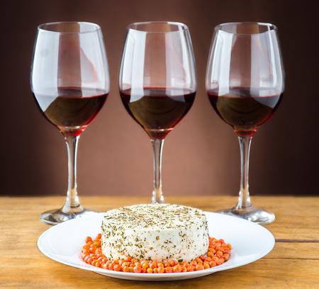 close up at a Panela cheese and wine glassesの写真素材