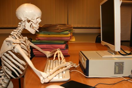 A keyworker working long hours into the nightの写真素材