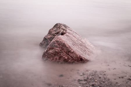 Stone details in the waterの写真素材